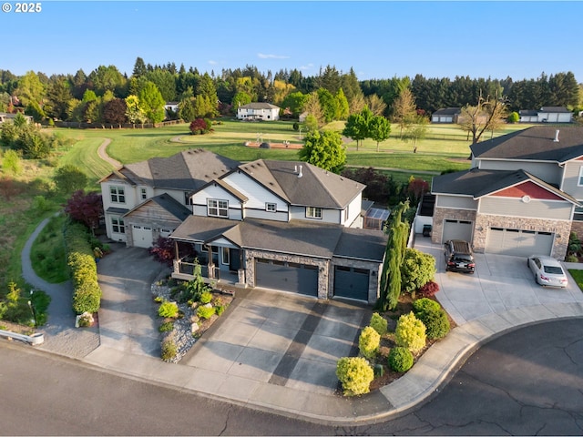 aerial view of residential area with a tree filled landscape