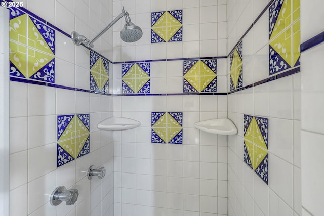 full bath featuring a tile shower