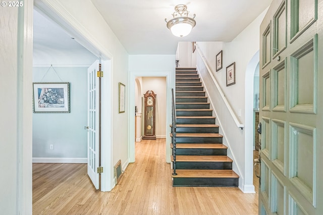 7150 SE 27th Ave, Portland, OR 97202 - staircase with arched walkways and hardwood / wood-style flooring