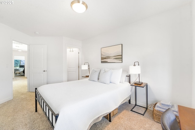 carpeted bedroom featuring baseboards