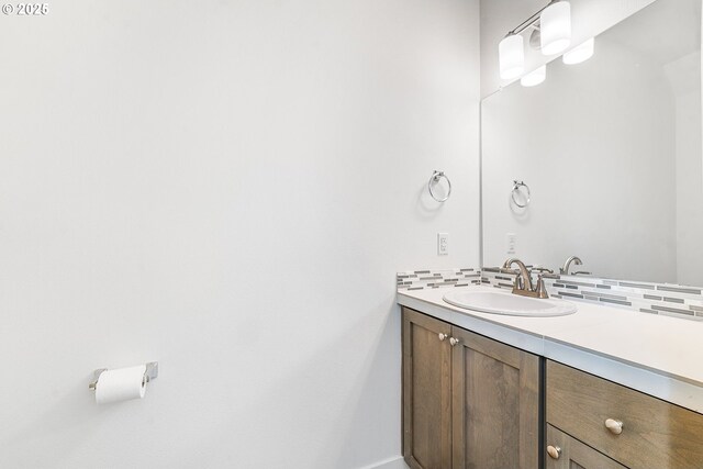 bathroom with backsplash and vanity