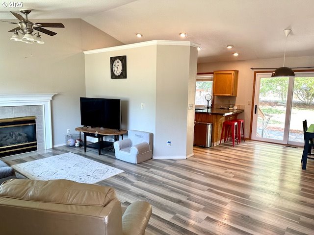 4120 NE 52nd St, Vancouver, WA 98661 - living room featuring a ceiling fan, light wood finished floors, recessed lighting, lofted ceiling, and a fireplace