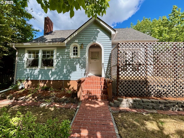 991 Polk St, Eugene, OR 97402 - view of front of house with a chimney and roof with shingles