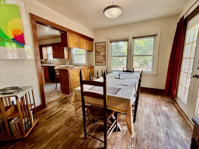 991 Polk St, Eugene, OR 97402 - dining space with dark wood-style floors and plenty of natural light