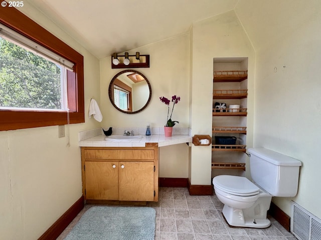 991 Polk St, Eugene, OR 97402 - bathroom with vaulted ceiling and vanity