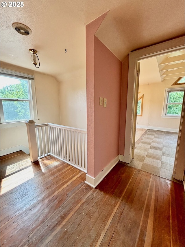 991 Polk St, Eugene, OR 97402 - unfurnished room featuring wood-type flooring and a textured ceiling
