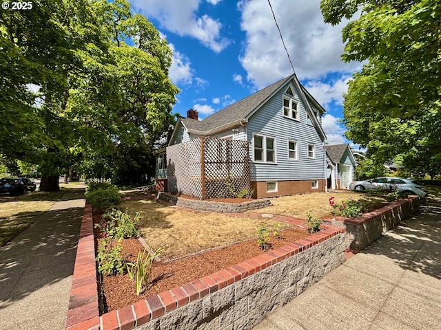 991 Polk St, Eugene, OR 97402 - view of front of property with a garage, a chimney, and driveway