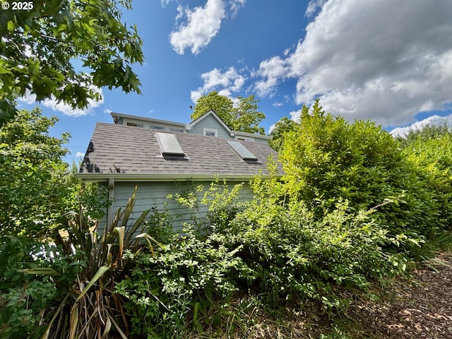 991 Polk St, Eugene, OR 97402 - view of home's exterior featuring roof with shingles