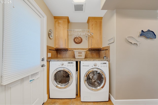 17460 Old Pacific Hwy, Rockaway Beach, OR 97136 - laundry room with washing machine and dryer, cabinet space, light tile patterned floors, and baseboards