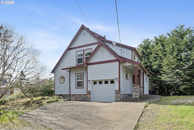 17460 Old Pacific Hwy, Rockaway Beach, OR 97136 - view of side of property featuring driveway, an attached garage, and board and batten siding