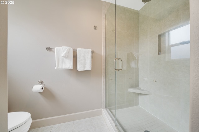 17460 Old Pacific Hwy, Rockaway Beach, OR 97136 - bathroom featuring a shower stall, toilet, tile patterned flooring, and baseboards