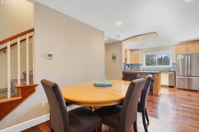 17460 Old Pacific Hwy, Rockaway Beach, OR 97136 - dining space featuring light wood-type flooring, stairway, baseboards, and recessed lighting