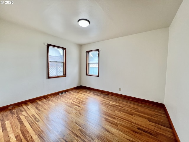 610 NE N St, Hermiston, OR 97838 - empty room featuring wood finished floors and baseboards