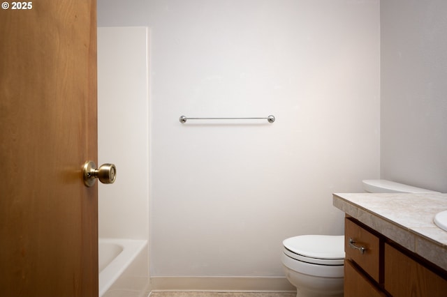 bathroom featuring toilet and vanity