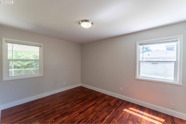 3826 SE 50th Ave, Portland, OR 97206 - unfurnished room with baseboards and dark wood-style floors