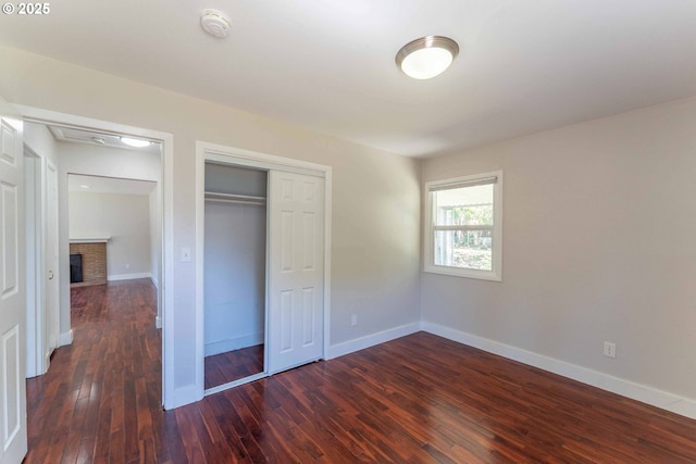 3826 SE 50th Ave, Portland, OR 97206 - unfurnished bedroom featuring hardwood / wood-style floors, a closet, and a fireplace