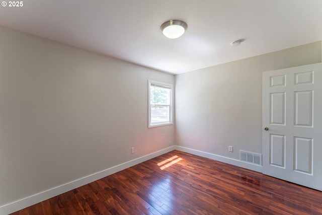 3826 SE 50th Ave, Portland, OR 97206 - empty room featuring dark wood-type flooring and a smoke detector