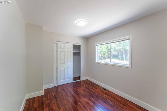 3826 SE 50th Ave, Portland, OR 97206 - unfurnished bedroom featuring a closet and dark wood-style flooring