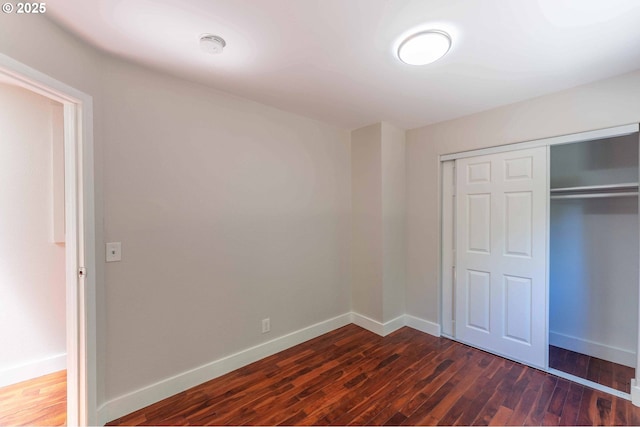3826 SE 50th Ave, Portland, OR 97206 - unfurnished bedroom featuring dark wood-style flooring and a closet