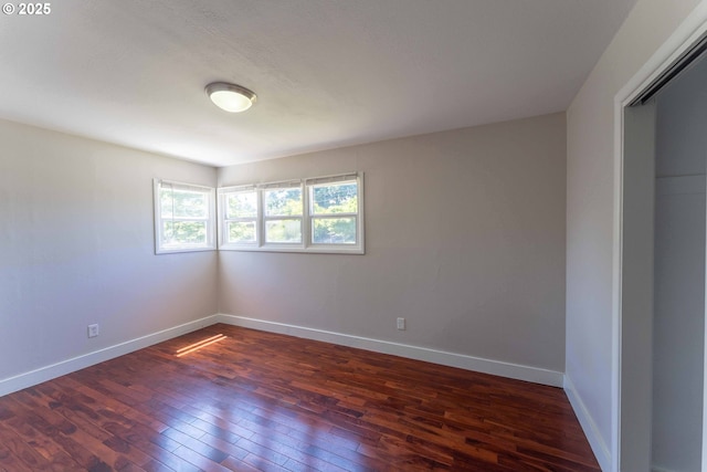 3826 SE 50th Ave, Portland, OR 97206 - empty room featuring dark wood-type flooring and baseboards