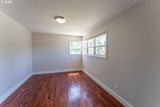 3826 SE 50th Ave, Portland, OR 97206 - empty room with dark wood-style floors and baseboards