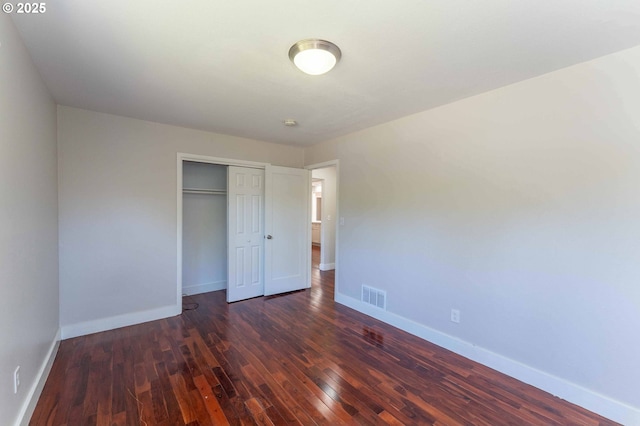 3826 SE 50th Ave, Portland, OR 97206 - unfurnished bedroom with dark wood-style flooring and a closet