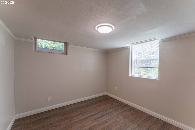 3826 SE 50th Ave, Portland, OR 97206 - spare room with dark wood-style floors, a textured ceiling, and ornamental molding