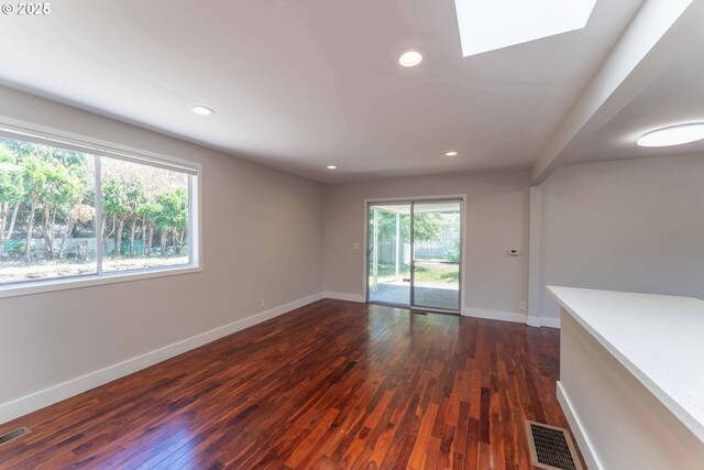 3826 SE 50th Ave, Portland, OR 97206 - unfurnished room with a skylight, dark wood-style floors, and recessed lighting