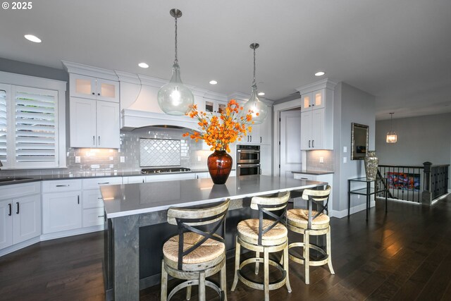 1936 NW Klickitat St, Camas, WA 98607 - kitchen with white cabinets, a sink, and dark wood finished floors
