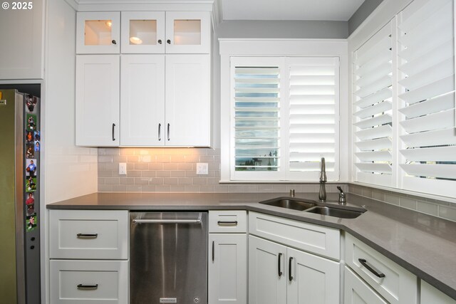 1936 NW Klickitat St, Camas, WA 98607 - kitchen featuring white cabinetry, a sink, stainless steel appliances, and tasteful backsplash