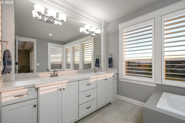 1936 NW Klickitat St, Camas, WA 98607 - full bath featuring double vanity, a bath, a sink, and an inviting chandelier