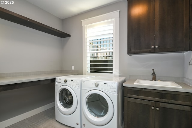 1936 NW Klickitat St, Camas, WA 98607 - laundry room featuring washing machine and clothes dryer, cabinet space, and a sink