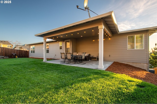 1936 NW Klickitat St, Camas, WA 98607 - back of property featuring a lawn, fence, and a patio area