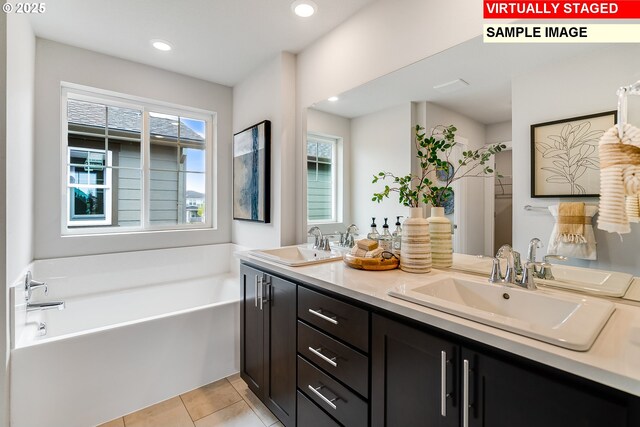 31713 NW Turel Dr, North Plains, OR 97133 - full bath with double vanity, plenty of natural light, a garden tub, tile patterned floors, and recessed lighting