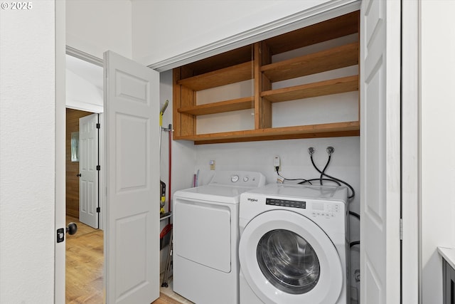 563 Fairway Dr, Gleneden Beach, OR 97388 - laundry room featuring washing machine and dryer and light wood-type flooring