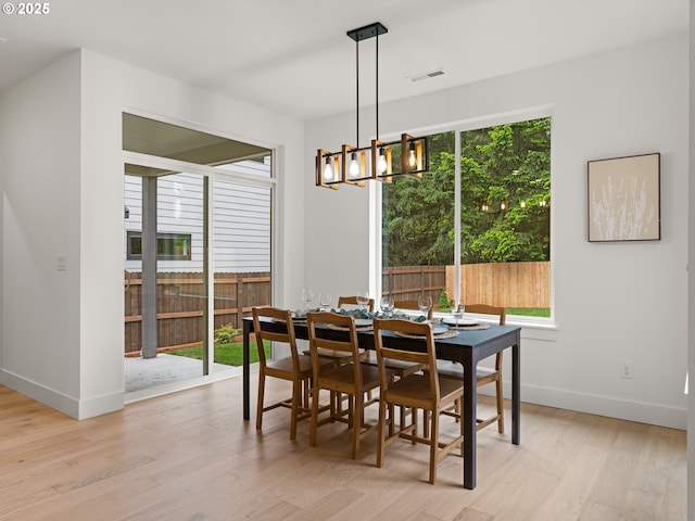 6719 NE 132nd St, Vancouver, WA 98686 - dining room featuring a chandelier, light wood-style flooring, and baseboards