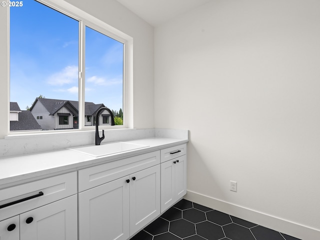 6719 NE 132nd St, Vancouver, WA 98686 - bathroom with a sink, tile patterned flooring, and baseboards