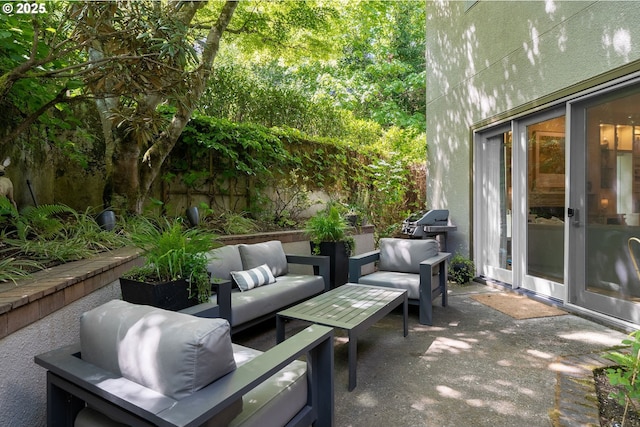 view of patio / terrace with an outdoor hangout area and fence