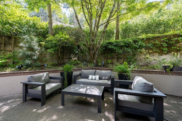 view of patio with an outdoor hangout area and fence