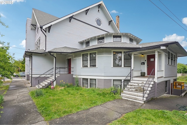 7809 NE Everett St, Portland, OR 97213 - view of front facade with a chimney and roof with shingles