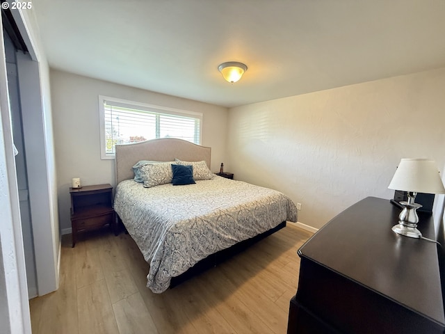 1206 Iris St, Brookings, OR 97415 - bedroom with light wood finished floors and baseboards