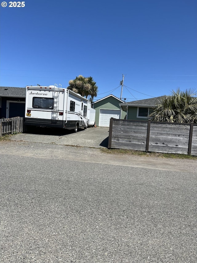 1206 Iris St, Brookings, OR 97415 - view of front of home with a detached garage