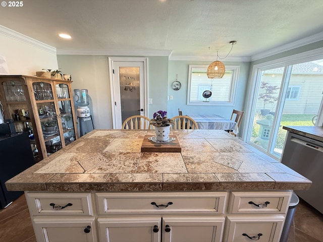 1206 Iris St, Brookings, OR 97415 - kitchen featuring dishwasher, a center island, crown molding, and tile countertops