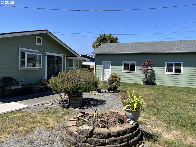 1206 Iris St, Brookings, OR 97415 - view of green lawn with a patio