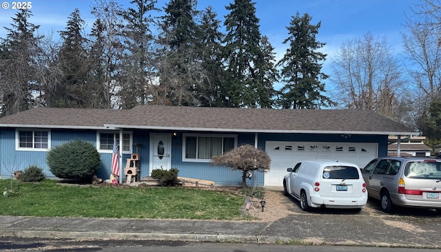 ranch-style house with an attached garage, a shingled roof, a front lawn, and aphalt driveway