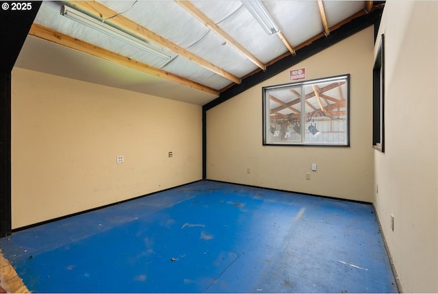 unfurnished room with concrete flooring
