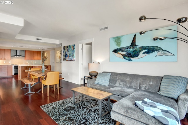 1260 NW Naito Pkwy Unit 103, Portland, OR 97209 - living room with dark wood-type flooring and baseboards
