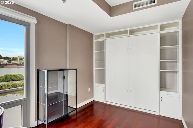 1260 NW Naito Pkwy Unit 103, Portland, OR 97209 - spare room featuring dark wood-type flooring and healthy amount of natural light