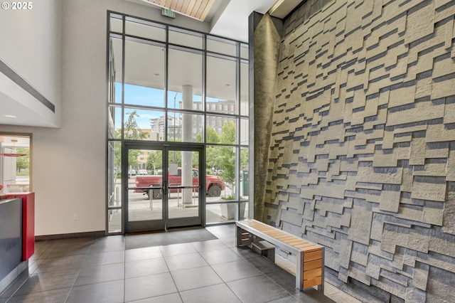 1260 NW Naito Pkwy Unit 103, Portland, OR 97209 - community lobby featuring a towering ceiling and floor to ceiling windows