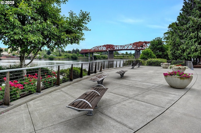 1260 NW Naito Pkwy Unit 103, Portland, OR 97209 - view of patio / terrace featuring a water view